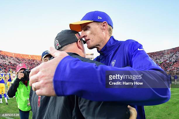Head coach Chip Kelly of the San Francisco 49ers greets interim head coach John Fassel of the Los Angeles Rams after the 49ers defeated the Rams...