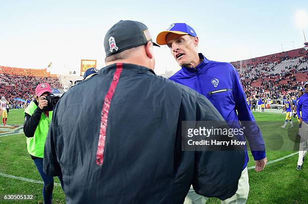 Head coach Chip Kelly of the San Francisco 49ers greets interim head coach John Fassel of the Los Angeles Rams after the 49ers defeated the Rams...