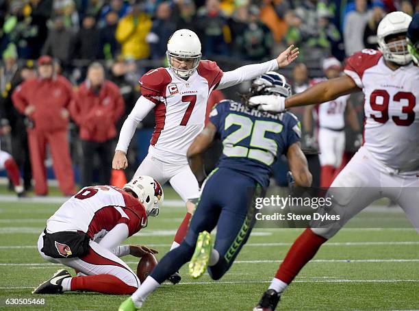 Kicker Chandler Catanzaro of the Arizona Cardinals kicks the game-winning field goal against the Seattle Seahawks at CenturyLink Field on December...