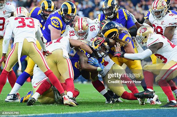 Todd Gurley of the Los Angeles Rams is stopped short of the goal line by the San Francisco 49ers defense during the fourth quarter of their game at...