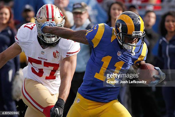 Tavon Austin of the Los Angeles Rams gets by Michael Wilhoite of the San Francisco 49ers during their game against the San Francisco 49ers at the Los...