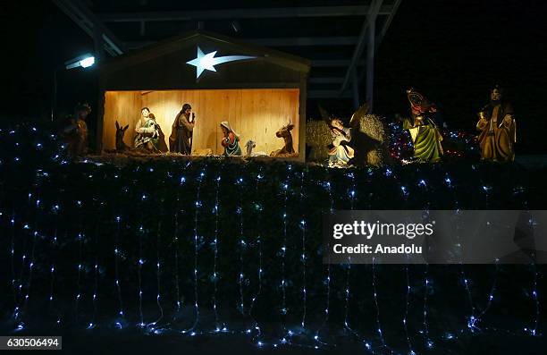 People attend a Christmas Eve, marking the birth of Jesus Christ, at the House of Virgin Mary at Selcuk district of Izmir, Turkey on December 24,...