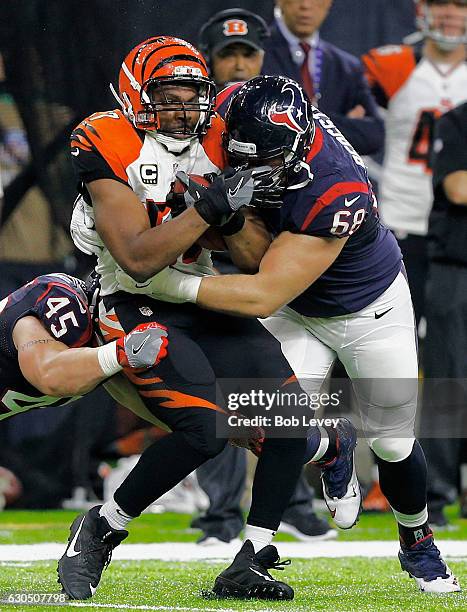 Vincent Rey of the Cincinnati Bengals is tackled by Tony Bergstrom of the Houston Texans and Jay Prosch at NRG Stadium on December 24, 2016 in...