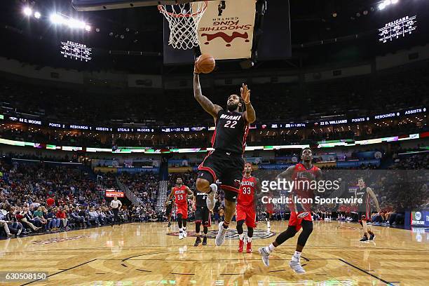 Miami Heat forward Derrick Williams drives to the basket against New Orleans Pelicans guard Jrue Holiday during the game between the against the New...