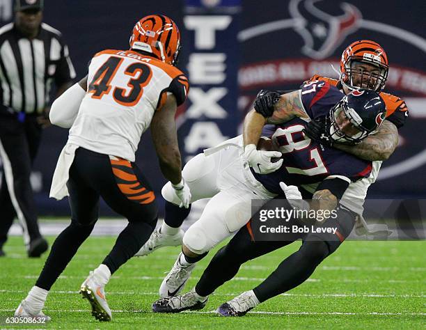 Fiedorowicz of the Houston Texans is tackled by Rey Maualuga of the Cincinnati Bengals as George Iloka looks on in the second quarter at NRG Stadium...