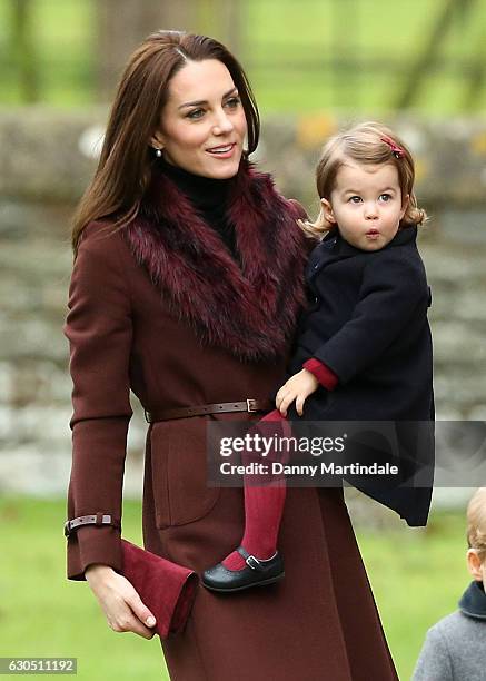 Catherine, Duchess of Cambridge and Princess Charlotte of Cambridge attend Church on Christmas Day on December 25, 2016 in Bucklebury, Berkshire.