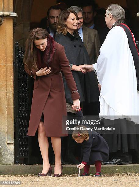 Princess Charlotte of Cambridge, Catherine, Duchess of Cambridge, Carole Middleton and Michael Middleton attend Church on Christmas Day on December...