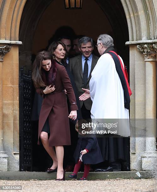 The Duchess of Cambridge, Carole and Michael Middleton and Princess Charlotte of Cambridge, leave following the service at St Mark's Church on...