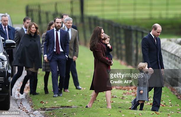 Britain's Prince William , Duke of Cambridge walks with his son Prince George by Catherine, Duchess of Cambridge and Princess Charlotte followed by...