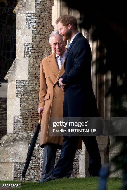 Britain's Prince Charles, Prince of Wales and Britain's Prince Harry attend a Christmas Day church service at St Mary Magdalene Church in...