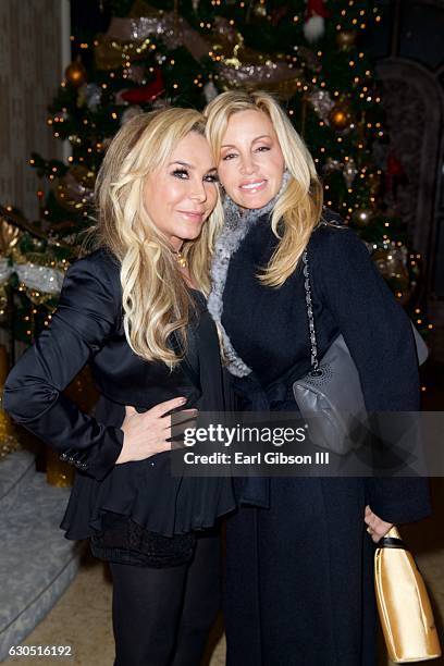Television personalities Adrienne Maloof and Camille Grammer attend Adrienne Maloof's Annual Holiday Party with Never Too Hungover on December 24,...