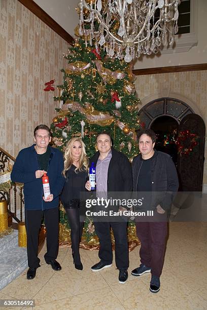 Joe Maloof, Adrienne Maloof, Gavin Maloof and George Maloof attend Adrienne Maloof's Annual Holiday Party with Never Too Hungover on December 24,...