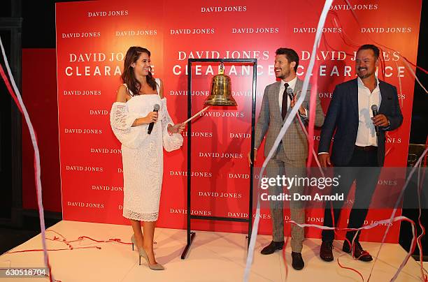 Jesinta Campbell rings the bell as Jason Dundas and David Collins look on during the Boxing Day sales on December 26, 2016 in Sydney, Australia....