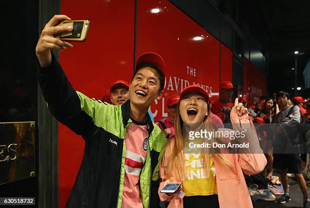 Shoppers at the front of the queue take a selfie outside the David Jones Elizabeth St store during the Boxing Day sales on December 26, 2016 in...
