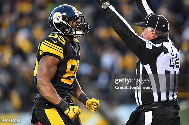 Xavier Grimble of the Pittsburgh Steelers reacts after a 20 yard touchdown reception in the first quarter during the game against the Baltimore...