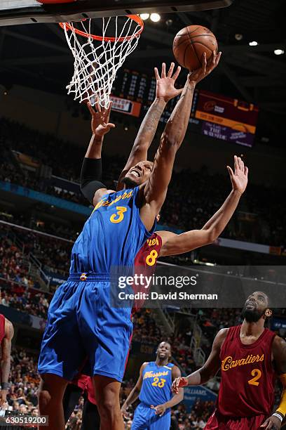 David West of the Golden State Warriors shoots the ball against the Cleveland Cavaliers during the game on December 25, 2016 at Quicken Loans Arena...