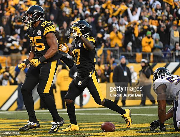 Xavier Grimble of the Pittsburgh Steelers reacts after a 20 yard touchdown reception in the first quarter during the game against the Baltimore...