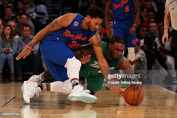 Derrick Rose of the New York Knicks and Jae Crowder of the Boston Celtics battle for the ball at Madison Square Garden on December 25, 2016 in New...