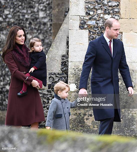 Prince William, Duke of Cambridge, Prince George of Cambridge, Catherine, Duchess of Cambridge and Princess Charlotte of Cambridge attend a Christmas...