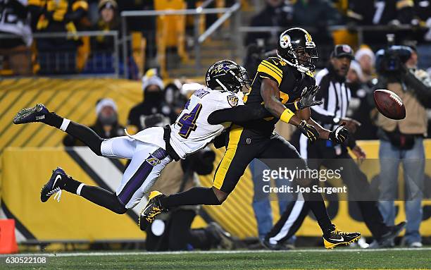 Antonio Brown of the Pittsburgh Steelers cannot make a catch while being defended by Shareece Wright of the Baltimore Ravens in the second half...