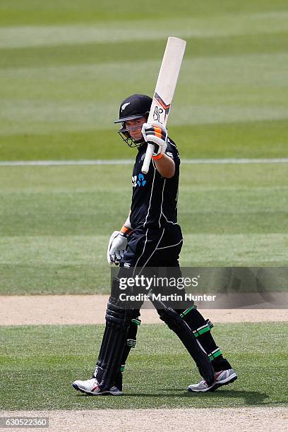 Tom Latham of New Zealand celebrates after reaching a half century during the first One Day International match between New Zealand and Bangladesh at...