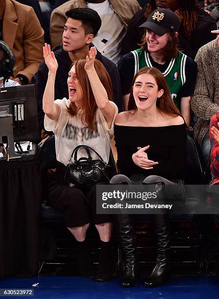 Julianne Moore and Liv Freundlich attend Boston Celtics Vs. New York Knicks game at Madison Square Garden on December 25, 2016 in New York City.