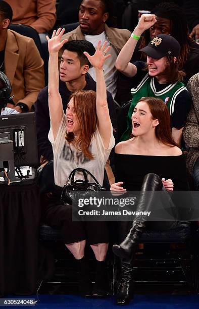 Julianne Moore and Liv Freundlich attend Boston Celtics Vs. New York Knicks game at Madison Square Garden on December 25, 2016 in New York City.