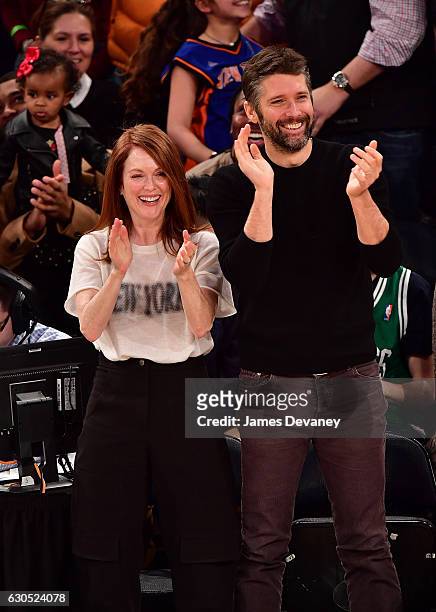 Julianne Moore and Bart Freundlich attend Boston Celtics Vs. New York Knicks game at Madison Square Garden on December 25, 2016 in New York City.