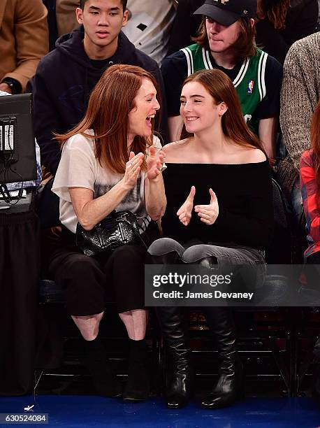 Julianne Moore and Liv Freundlich attend Boston Celtics Vs. New York Knicks game at Madison Square Garden on December 25, 2016 in New York City.