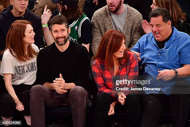 Julianne Moore, Bart Freundlich, Laura Schirripa and Steve Schirripa attend Boston Celtics Vs. New York Knicks game at Madison Square Garden on...