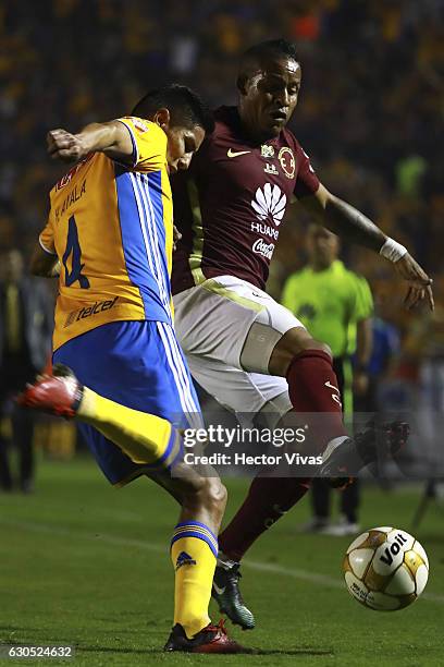 Michael Arroyo of America struggles for the ball with Hugo Ayala of Tigres during the Final second leg match between Tigres UANL and America as part...