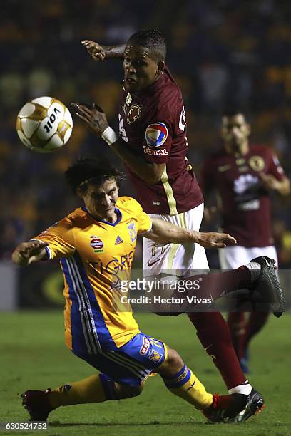 Michael Arroyo of America struggles for the ball with Jorge Estrada of Tigres during the Final second leg match between Tigres UANL and America as...