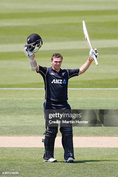 Tom Latham of New Zealand celebrates after reaching a century during the first One Day International match between New Zealand and Bangladesh at...