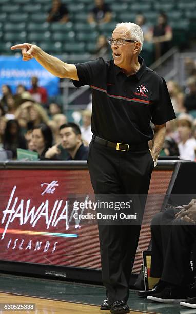 Head coach Steve Fisher of the San Diego State Aztecs gestures to his players from the sideline during the first half of the Diamond Head Classic...