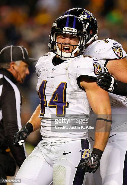 Kyle Juszczyk of the Baltimore Ravens reacts after rushing for a 10 yard touchdown in the fourth quarter during the game against the Pittsburgh...