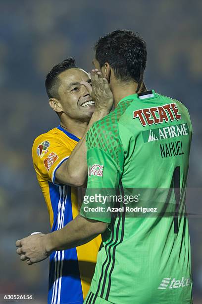 Juninho of Tigres celebrates with teammate Nahuel Guzman after scoring his penalty during the Final second leg match between Tigres UANL and America...