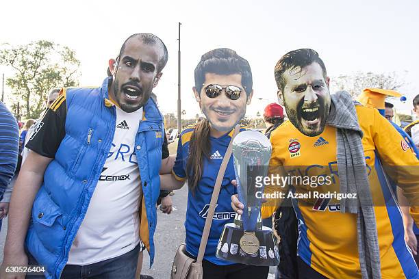 Fans of Tigres wearing masks of Guido Pizarro, Damian Alvarez and Andre Gignac pose prior the Final second leg match between Tigres UANL and America...