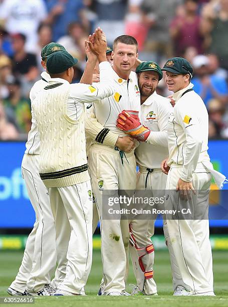 Jackson Bird of Australia is congratulated by team mates after getting the wicket of Younis Khan of Pakistan during day one of the Second Test match...