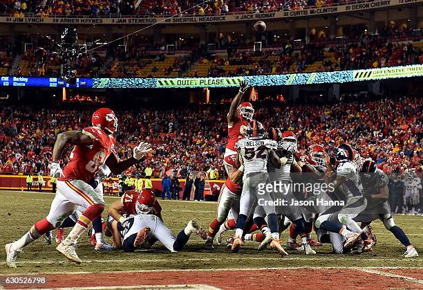 Nose tackle Dontari Poe of the Kansas City Chiefs passes to tight end Demetrius Harris in the end zone for a touchdown during the 4th quarter of the...