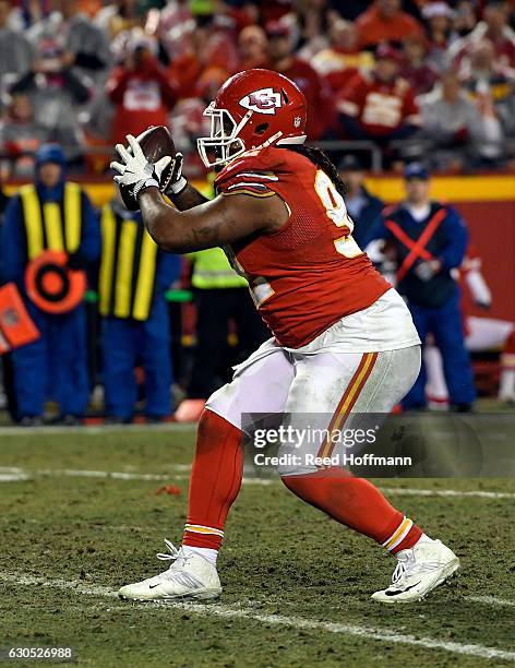 Nose tackle Dontari Poe of the Kansas City Chiefs passes to tight end Demetrius Harris in the end zone for a touchdown during the 4th quarter of the...