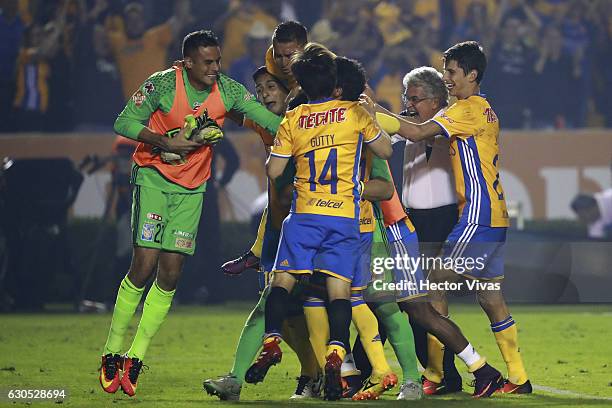 Players of Tigres celebrate with goalkeeper Nahuel Guzman after winning the game during the Final second leg match between Tigres UANL and America as...