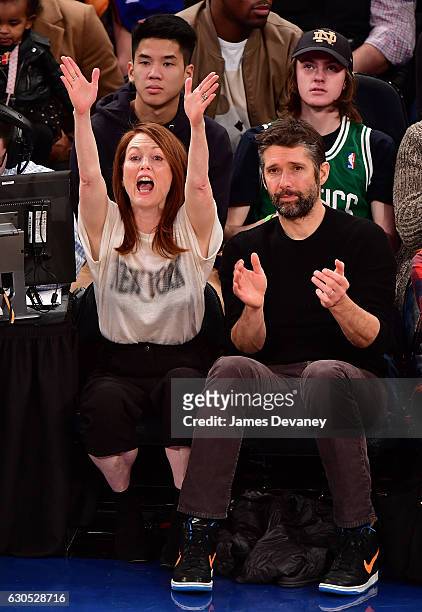 Julianne Moore and Bart Freundlich attend Boston Celtics Vs. New York Knicks game at Madison Square Garden on December 25, 2016 in New York City.