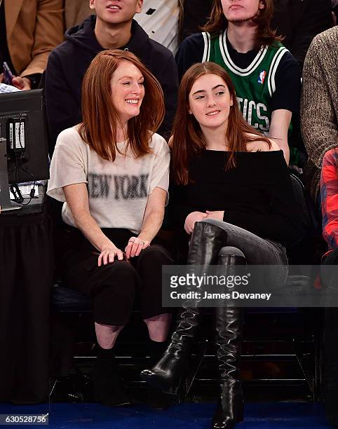 Julianne Moore and Liv Freundlich attend Boston Celtics Vs. New York Knicks game at Madison Square Garden on December 25, 2016 in New York City.