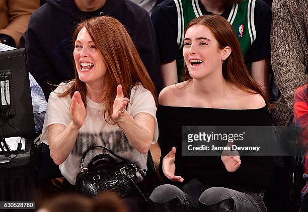 Julianne Moore and Liv Freundlich attend Boston Celtics Vs. New York Knicks game at Madison Square Garden on December 25, 2016 in New York City.