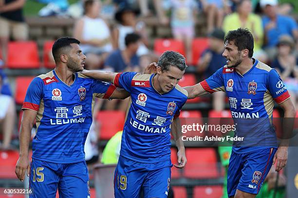 Andrew Nabbout, Mateo Poljak and Morten Nordstrand of the Jets celebrate a goal during the round 12 A-League match between the Newcastle Jets and the...