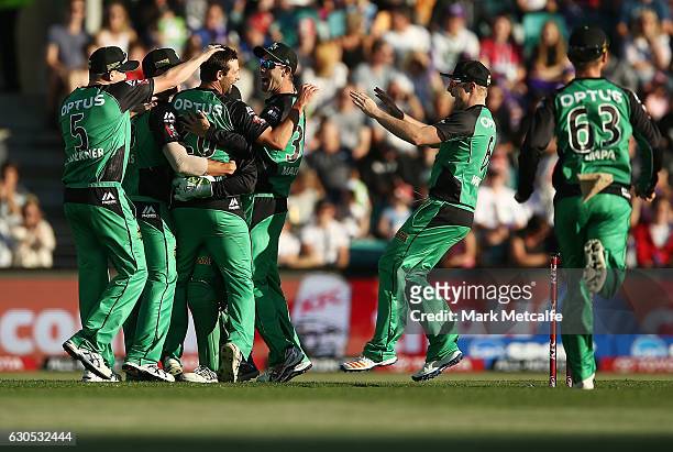 Ben Hilfenhaus of the Stars celebrates with team mates after taking the wicket of Dom Michael of the Hurricanes during the Big Bash League match...
