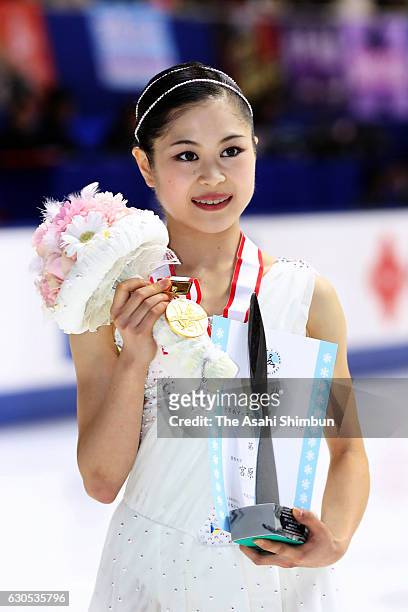 Gold medalist Satoko Miyahara poses for photogrpahs after the medal ceremony for the Women's Singles during day four of the 85th All Japan Figure...