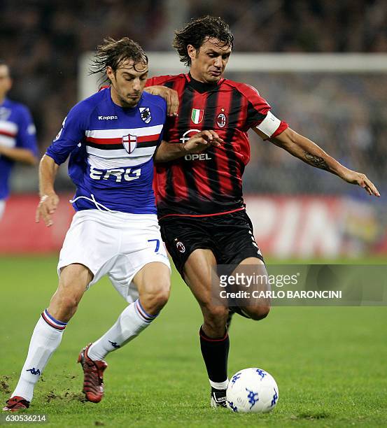 Italian Cristian Zenoni of Sampdoria vies with AC Milan captain Paolo Maldini in a Serie A match at Luigi Ferraris stadium in Genoa 30 October 2004....