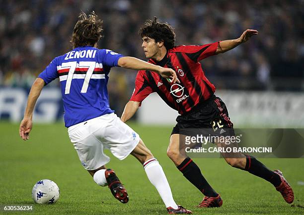 Milan Brazilian forward Kaka duels with Italian Cristian Zenoni of Sampdoria durind their Serie A football match at Luigi Ferraris stadium in Genoa...
