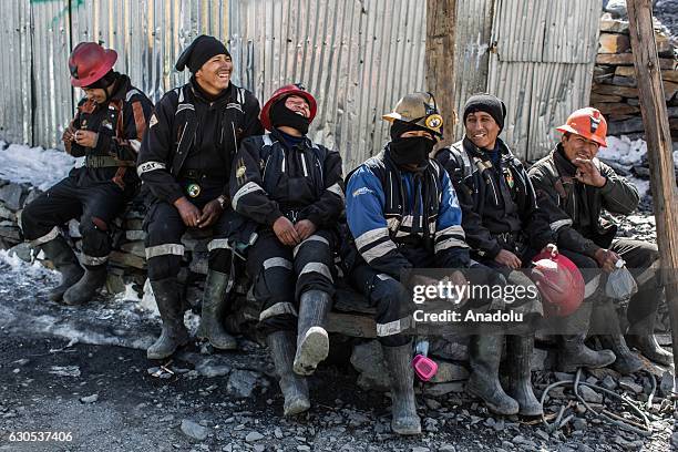 Miners take a break at gold mines in La Rinconada, the highest permanent settlement in the world, in Puno, Peru on November 1, 2016. Miners work...